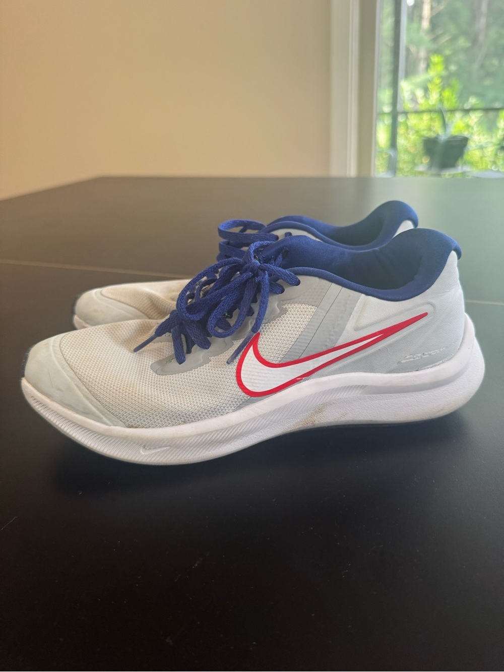 Nike Kids White Sneakers with Blue Collar and Red Swoosh